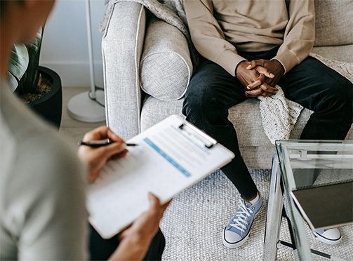 man speaking with doctor